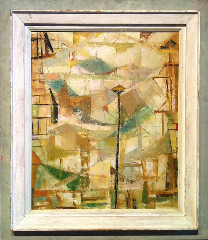 Abstract oil painting featuring muted green, blue, and yellow angular shapes and lines in a white-and-green wooden frame