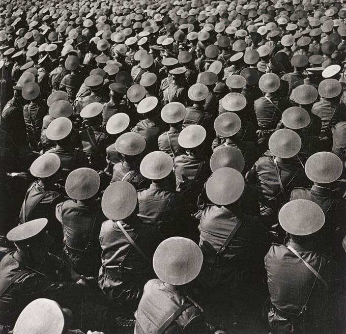 A black and white photo of a large army of Chinese military officers wearing distinct hats.