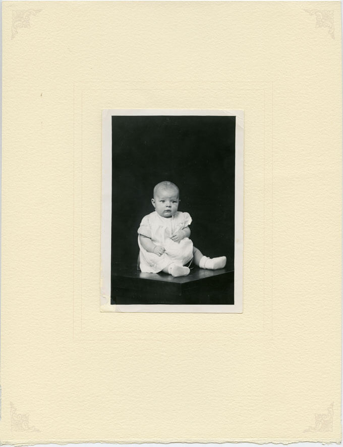 Baby seated on table