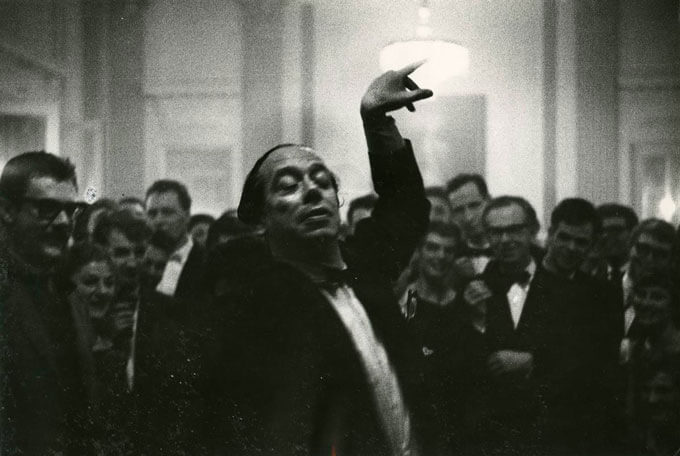 Man dancing in front of crowd, Amsterdam, Holland, 1959