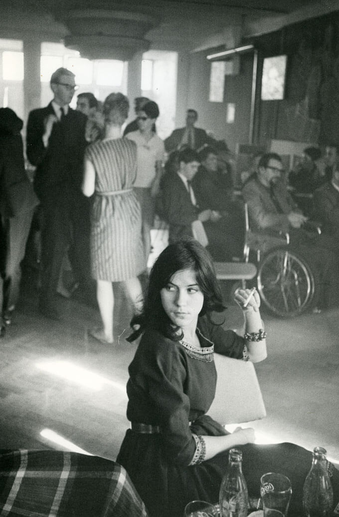 Woman smokes at a student dance, Amsterdam, Holland, 1960