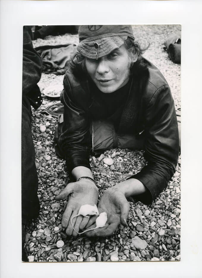 Hippie displaying mice he keeps in his hat, England