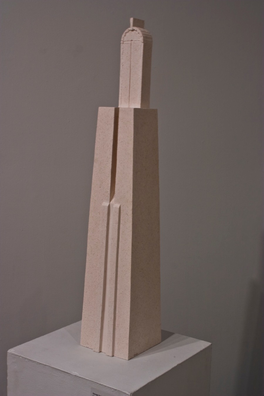 Tall and narrow geometric architectural porcelain sculpture with four sides 