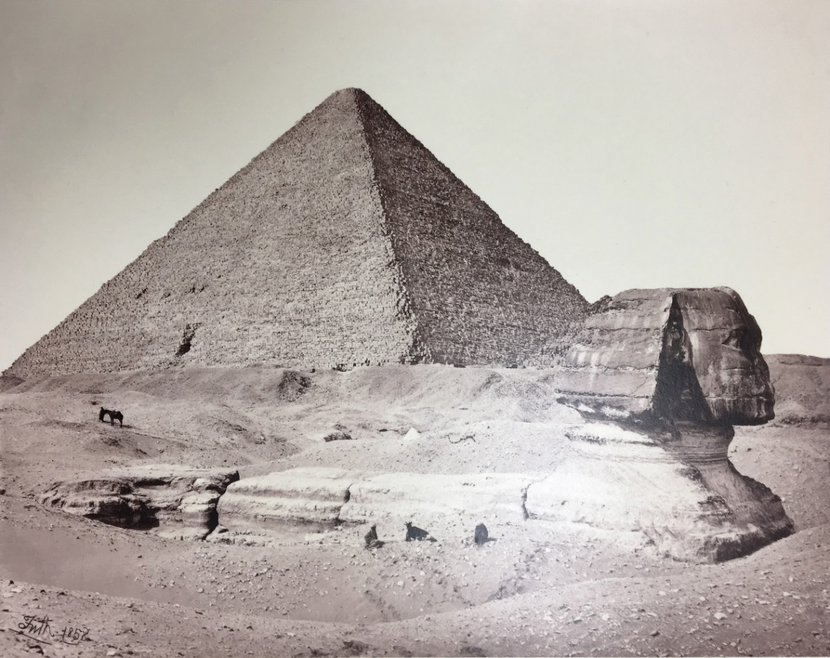 Silver print photograph of an Egyptian pyramid and a large Sphinx 